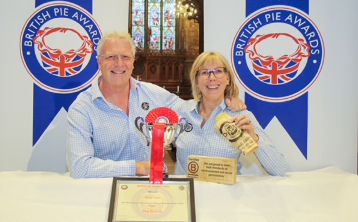 The founders of the Phat Pasty Company receiving their "Pasty of the Year" award for their vegan pasty