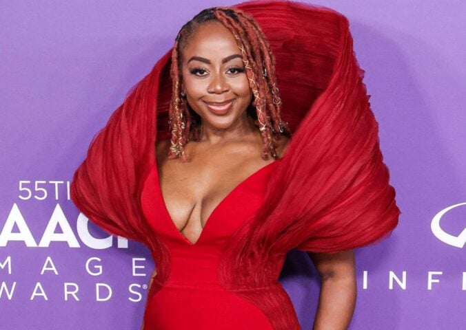 Slutty Vegan founder Pinky Cole Hayes on the red carpet in a red dress