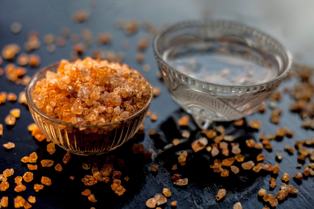 Photo shows a small dish of gond katara, or gond katira, the form of gum tragacanth most commonly used in Indian cuisine