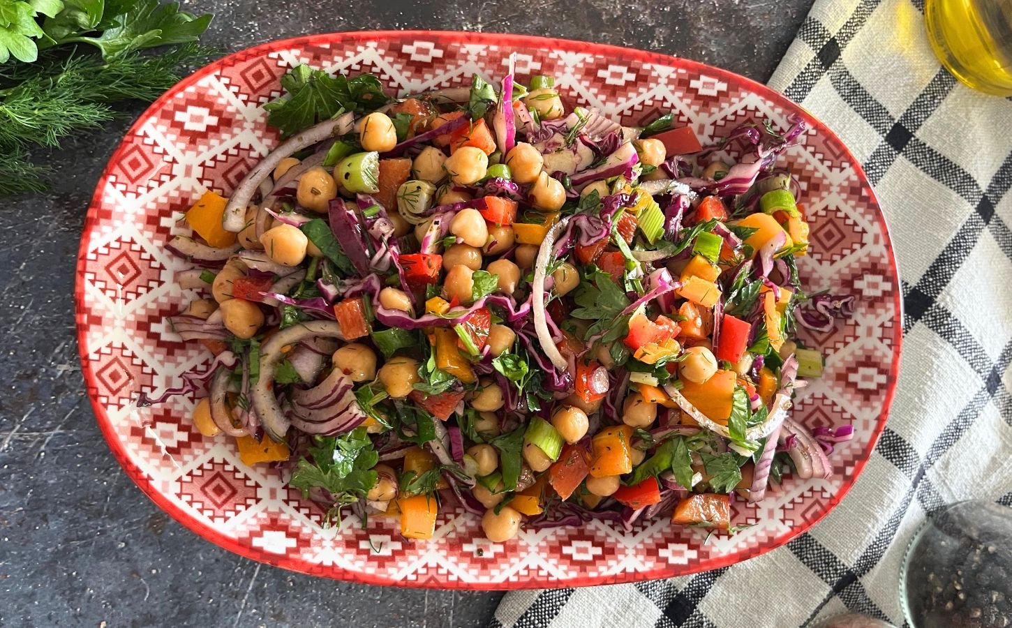 vegan, nut-free, gluten-free chickpea rainbow salad made with cucumber, cabbage, onion, bell peppers and a simple salad dressing