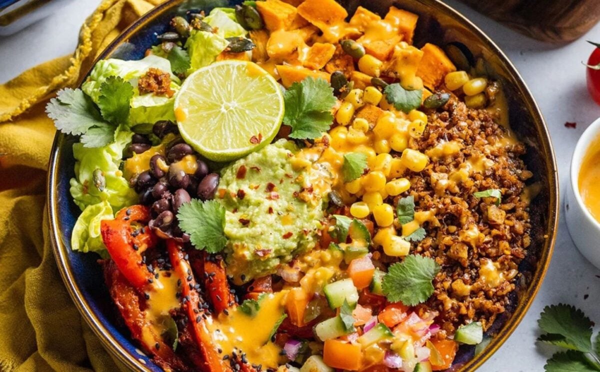 Photo shows a large vegan burrito bowl made using walnut-based "mince" as the main protein