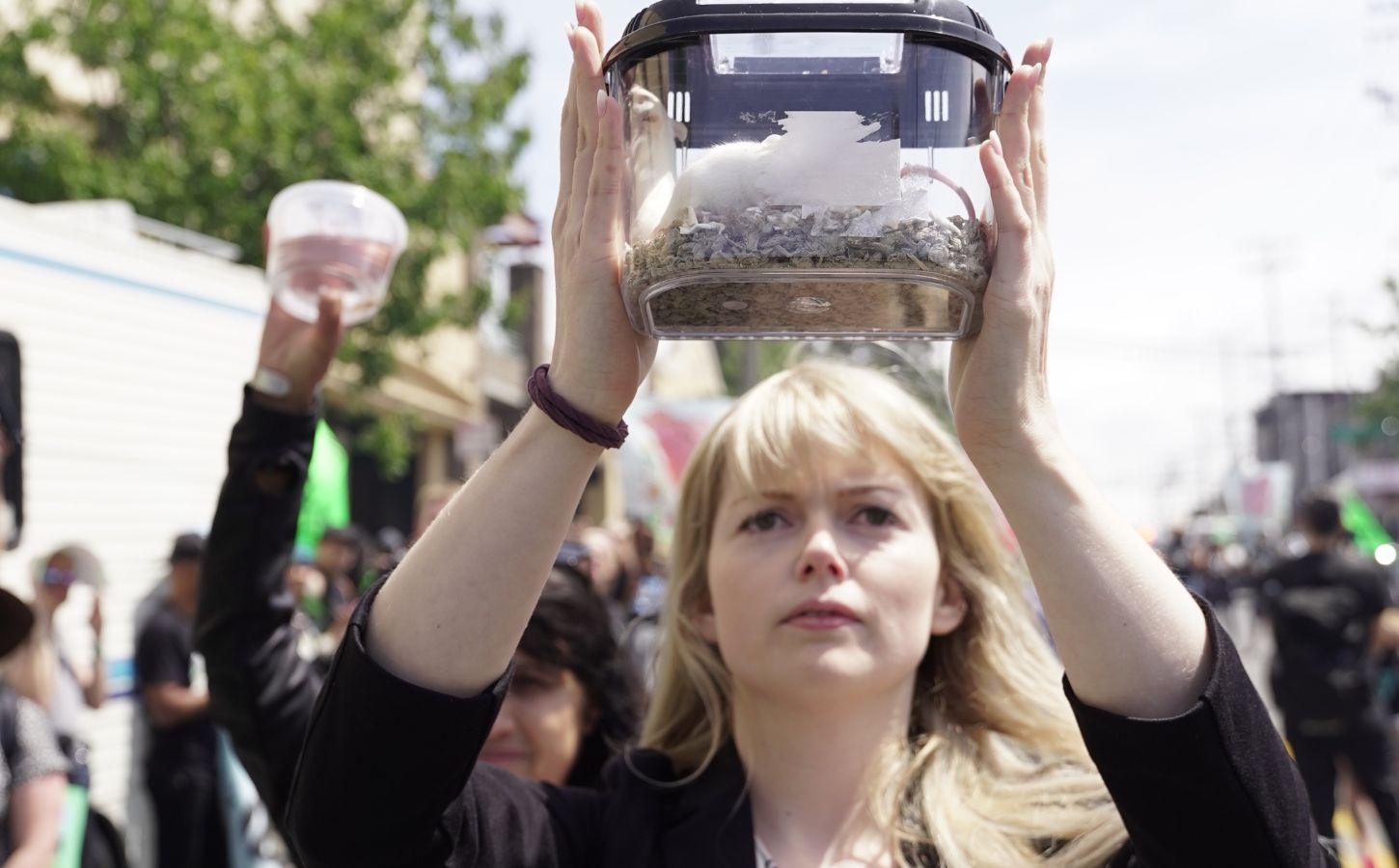 Direct Action Everywhere activist Celeste Esser carrying mice she rescued from Petco