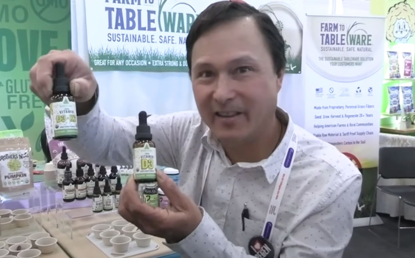 A still from a video from YouTuber John Kohler of OkRaw holding up some of his favorite vegan health products